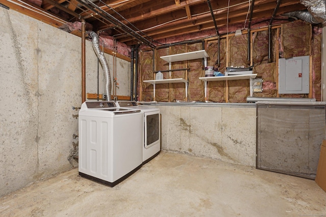 basement with electric panel and independent washer and dryer