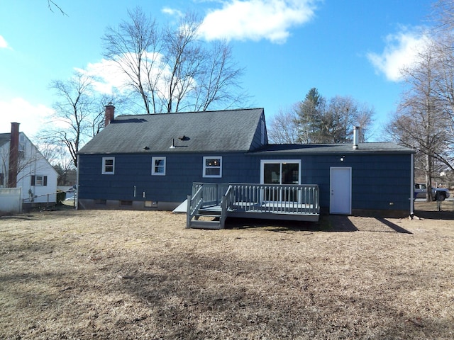 back of house featuring a deck