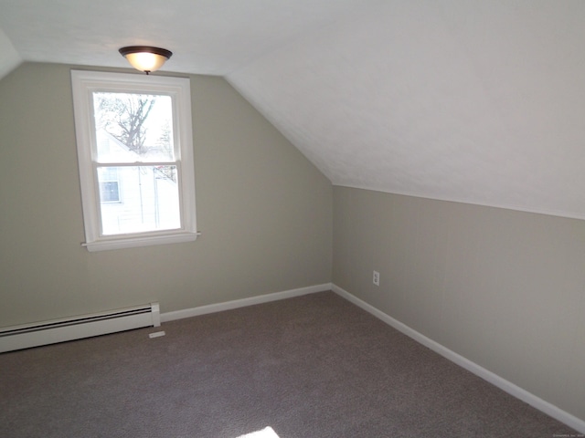 additional living space with lofted ceiling, carpet floors, and a baseboard heating unit