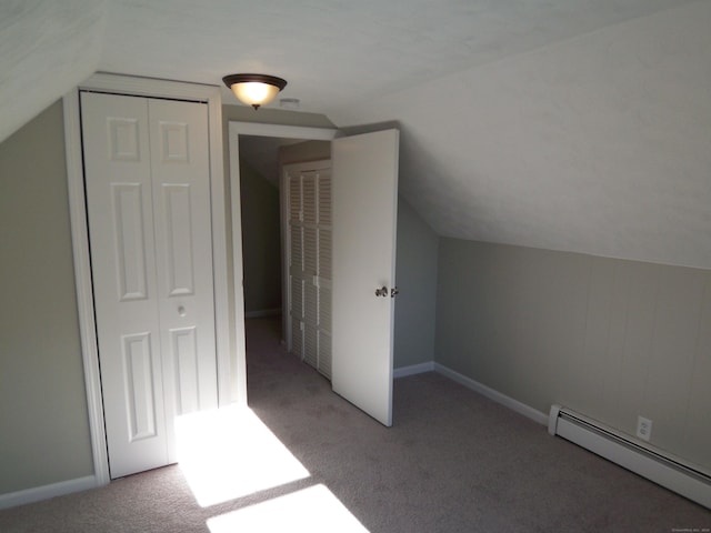 bonus room with lofted ceiling, carpet floors, and a baseboard heating unit