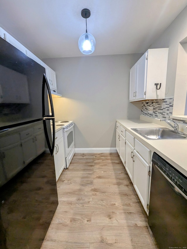 kitchen with white electric range oven, sink, black dishwasher, pendant lighting, and white cabinets