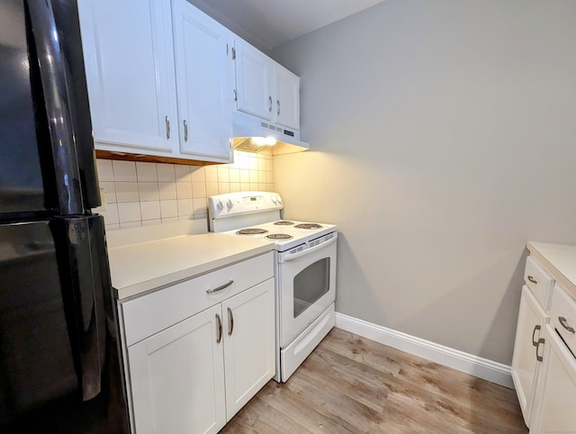 kitchen with electric stove, black refrigerator, white cabinets, decorative backsplash, and light wood-type flooring