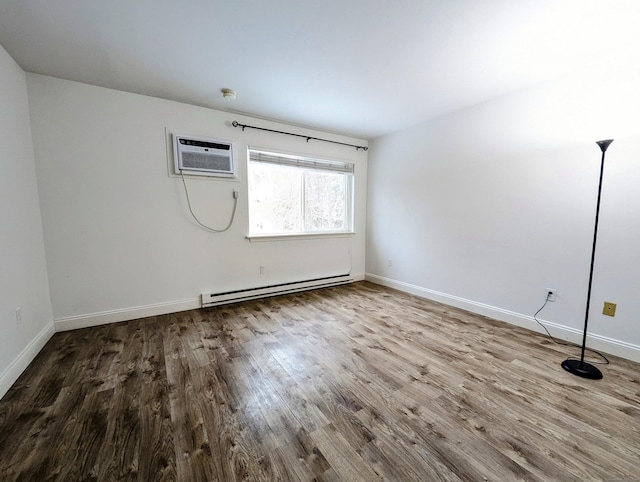 unfurnished room featuring baseboard heating, wood-type flooring, and a wall mounted AC