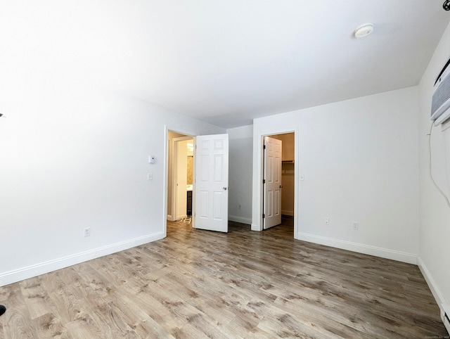 unfurnished bedroom with light hardwood / wood-style flooring