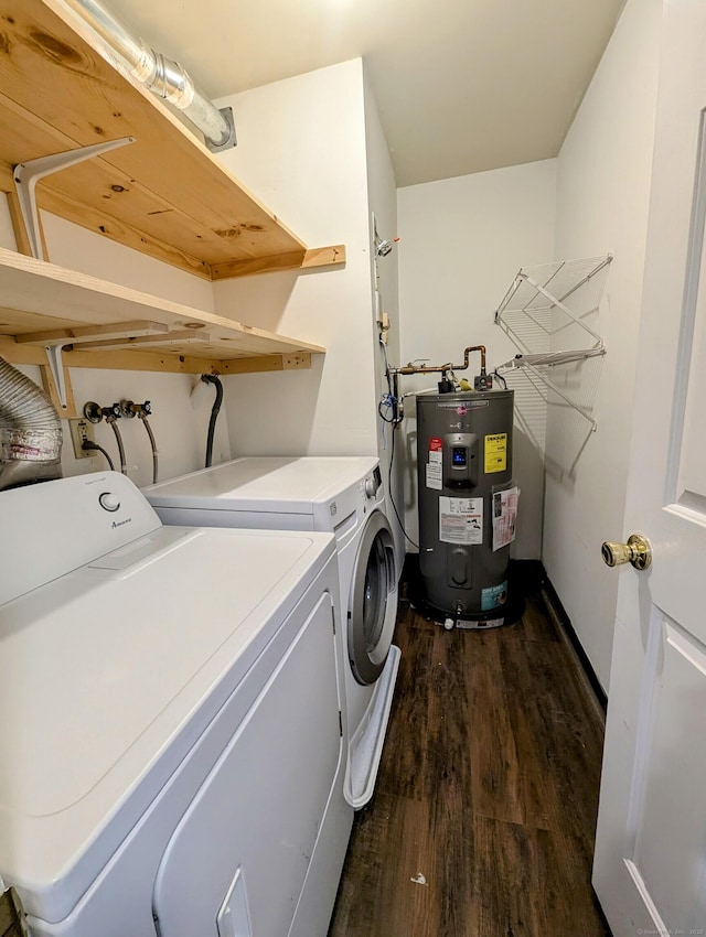 laundry area with water heater, dark hardwood / wood-style flooring, and washer and clothes dryer