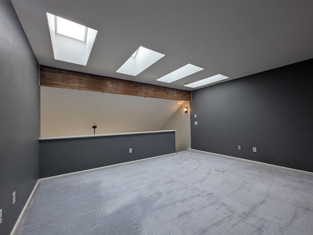 unfurnished room with carpet and vaulted ceiling with beams