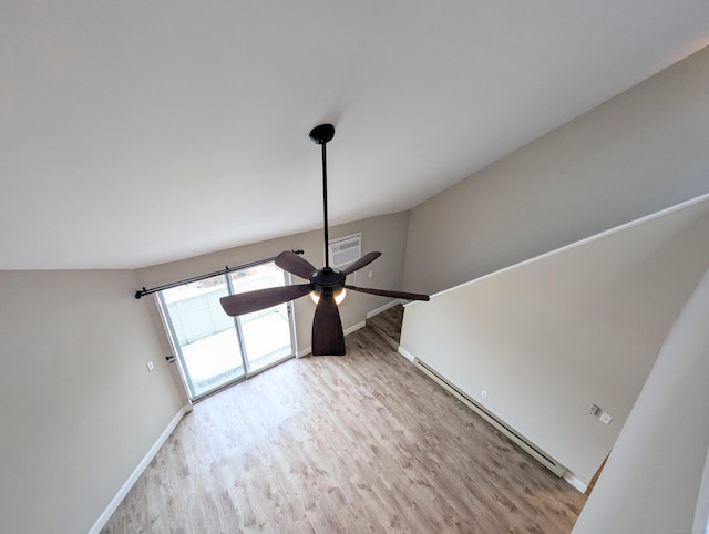 room details with a baseboard heating unit, hardwood / wood-style flooring, and ceiling fan