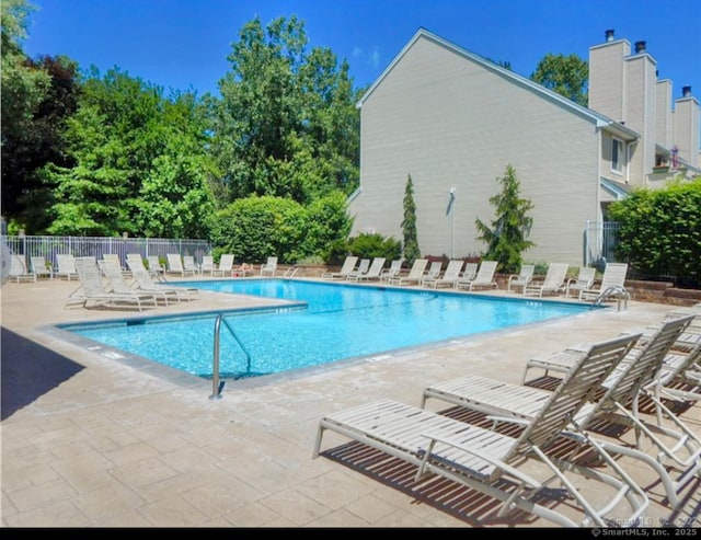 view of swimming pool with a patio area