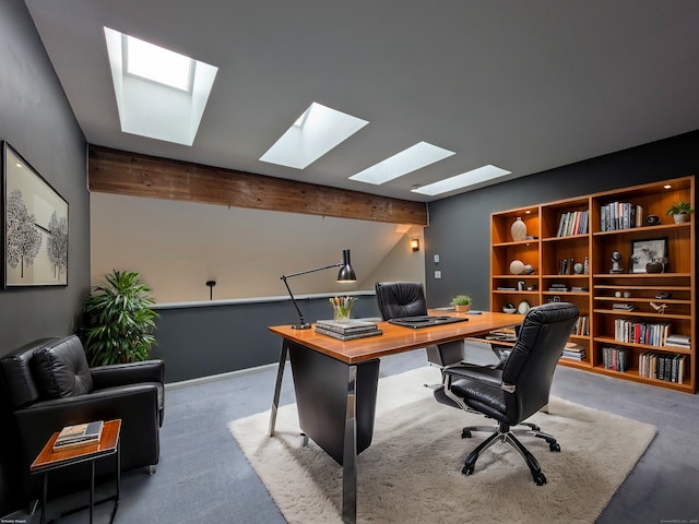 carpeted office space with vaulted ceiling with beams