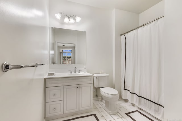 full bathroom with tile patterned floors, curtained shower, toilet, and vanity