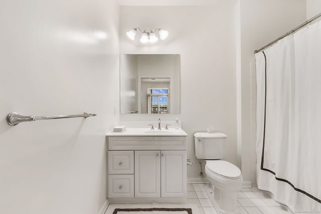 full bathroom with tile patterned floors, toilet, a shower with shower curtain, baseboards, and vanity