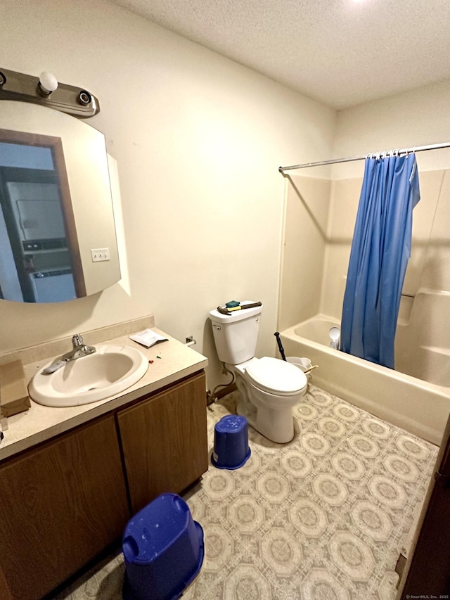 full bathroom featuring vanity, shower / tub combo, a textured ceiling, and toilet