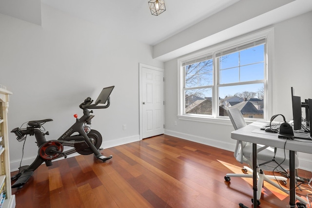 office area with baseboards and wood finished floors