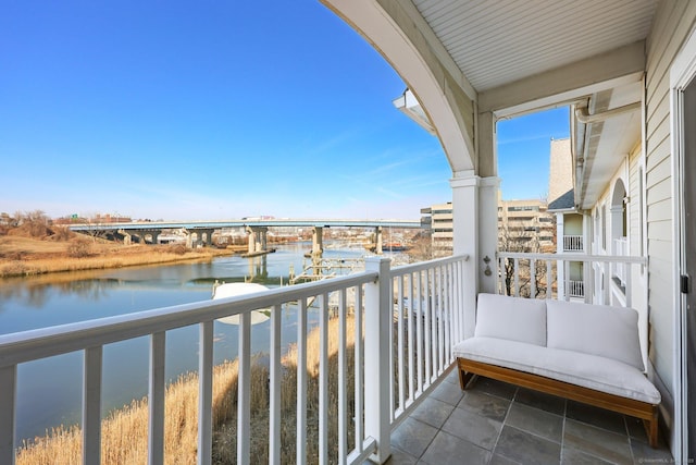 balcony featuring a water view