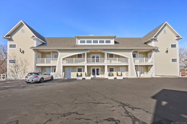 view of building exterior with uncovered parking