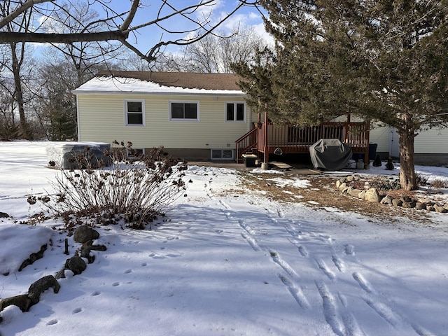 view of front of property with a wooden deck