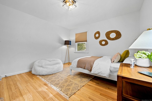 bedroom with hardwood / wood-style flooring