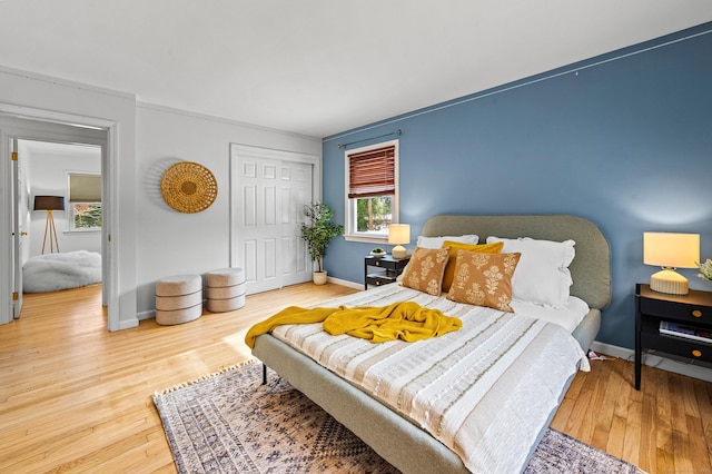 bedroom featuring hardwood / wood-style floors and a closet