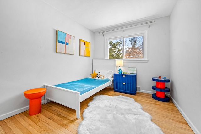 bedroom with light wood-type flooring