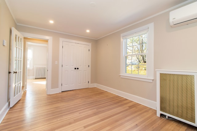 unfurnished bedroom featuring ornamental molding, radiator heating unit, and an AC wall unit