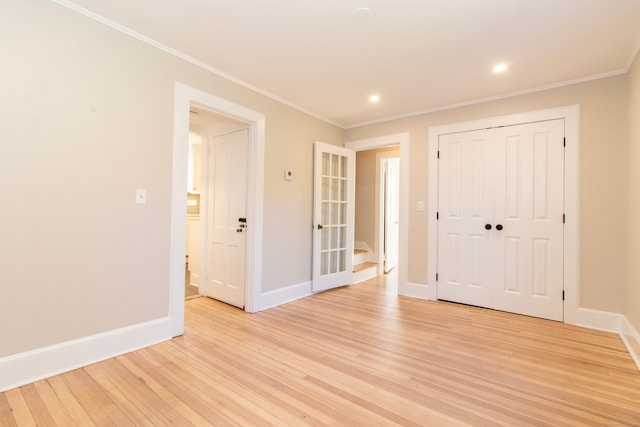 interior space with crown molding and light wood-type flooring