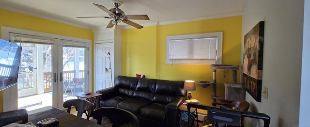 living room featuring ceiling fan, crown molding, and french doors