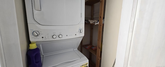 laundry area featuring stacked washer / dryer