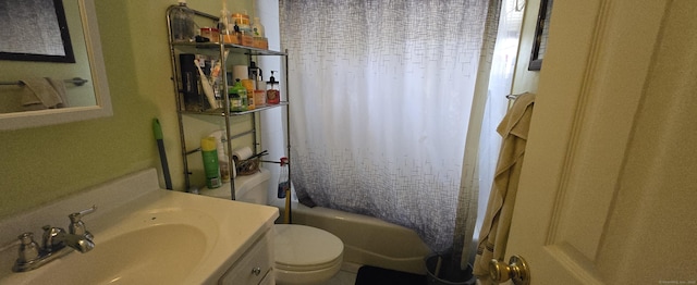 full bathroom featuring toilet, vanity, and shower / bath combo with shower curtain