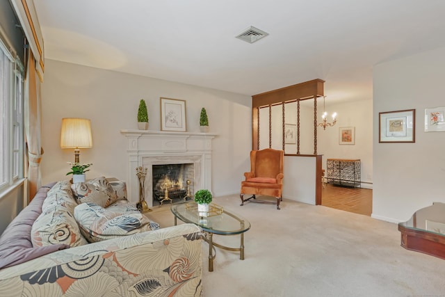 living room featuring a high end fireplace, a chandelier, and light colored carpet