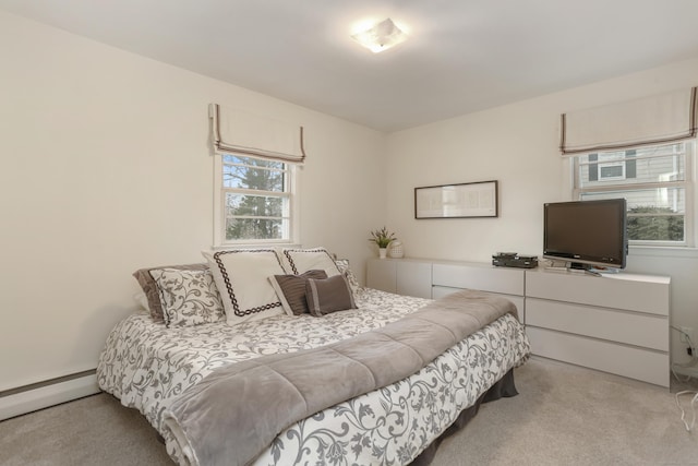 carpeted bedroom with a baseboard radiator