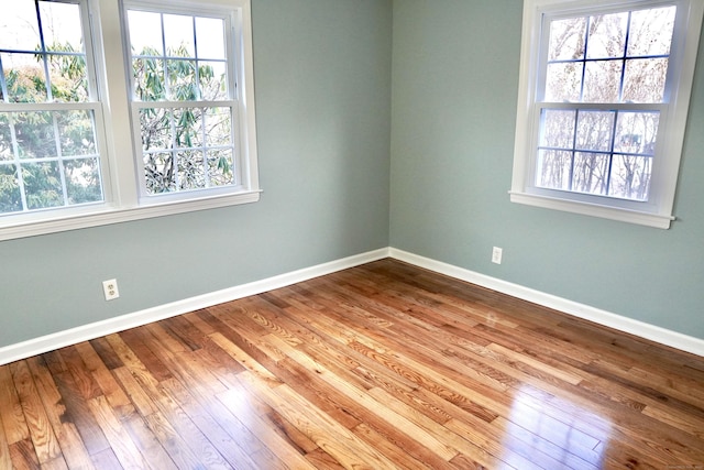 empty room featuring hardwood / wood-style flooring