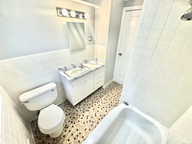 bathroom with tile patterned flooring, vanity, tile walls, a bathtub, and toilet