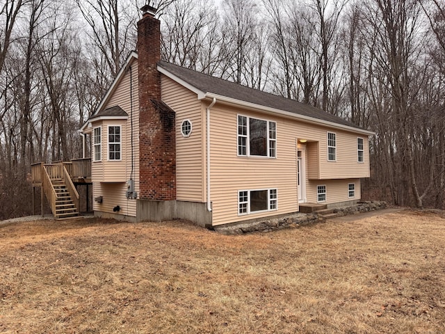 exterior space with a deck and a yard