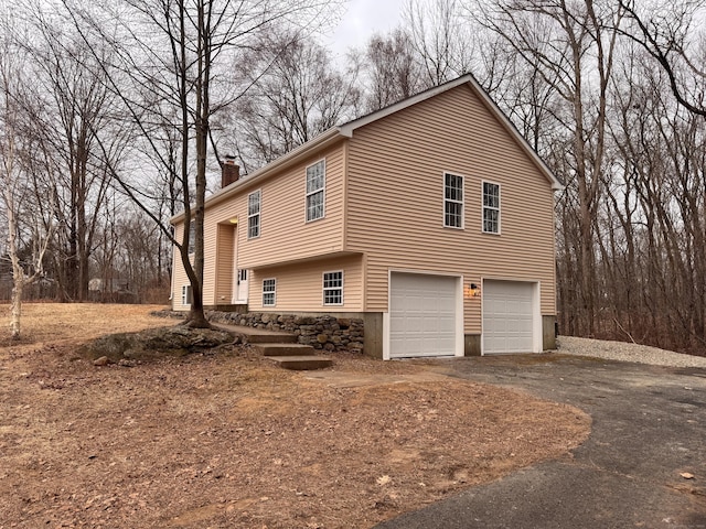 view of property exterior with a garage