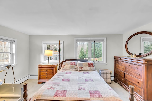 carpeted bedroom with a baseboard heating unit