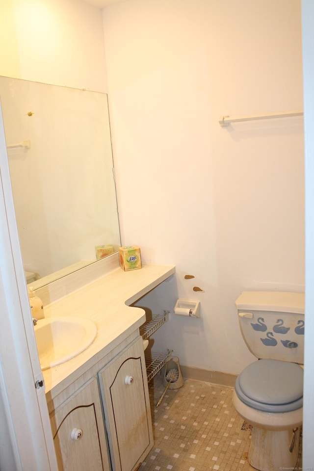 bathroom with vanity and toilet