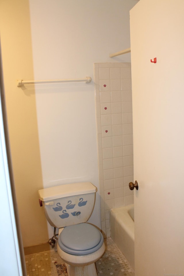 bathroom featuring a bathtub and tile patterned flooring