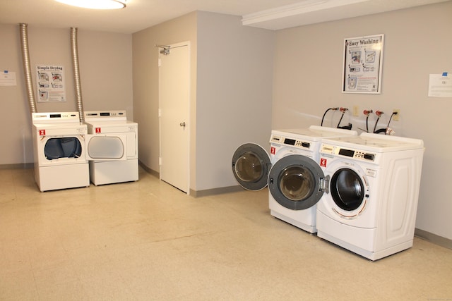 washroom featuring washer and dryer