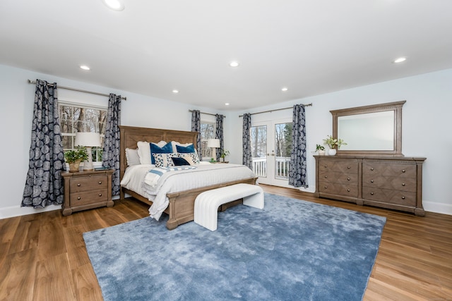 bedroom featuring french doors and wood-type flooring