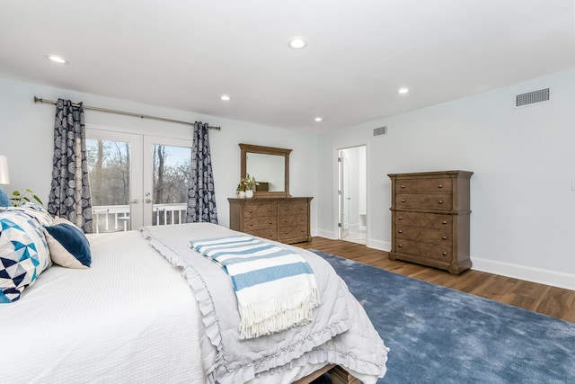 bedroom with dark wood-type flooring, french doors, and access to outside