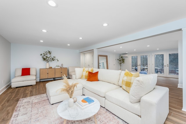 living room featuring light hardwood / wood-style flooring and french doors