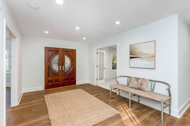 foyer featuring french doors and wood-type flooring