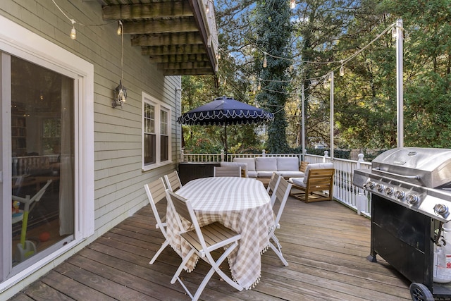 wooden deck featuring an outdoor hangout area and area for grilling