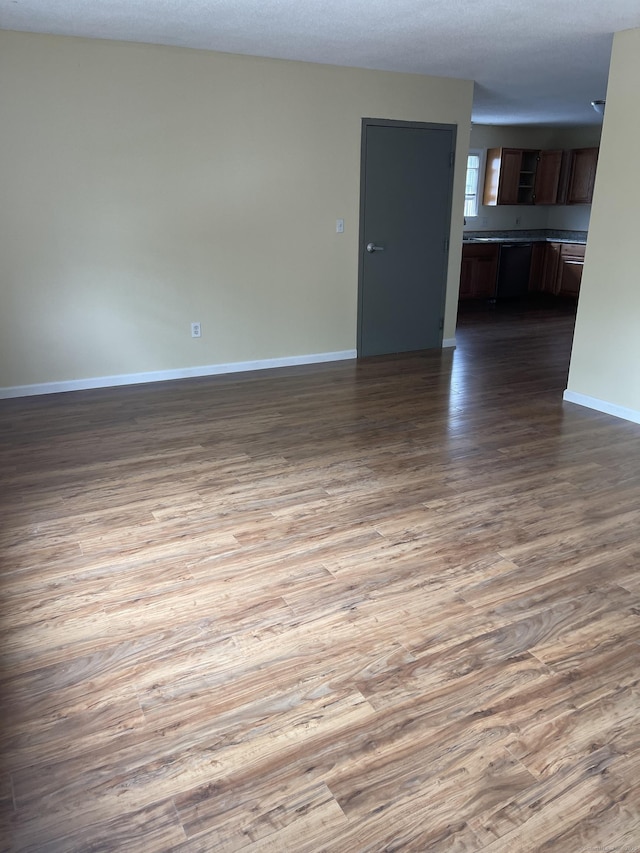 empty room with hardwood / wood-style flooring