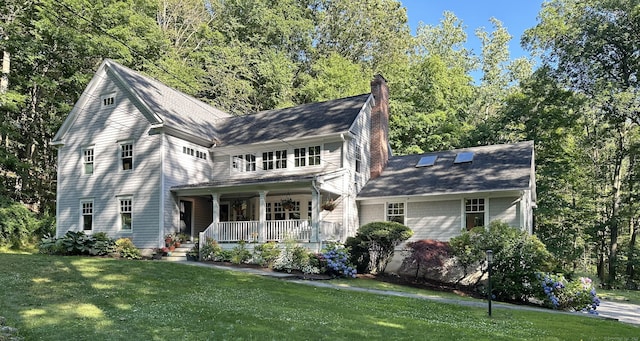 view of front of home with a front lawn and covered porch