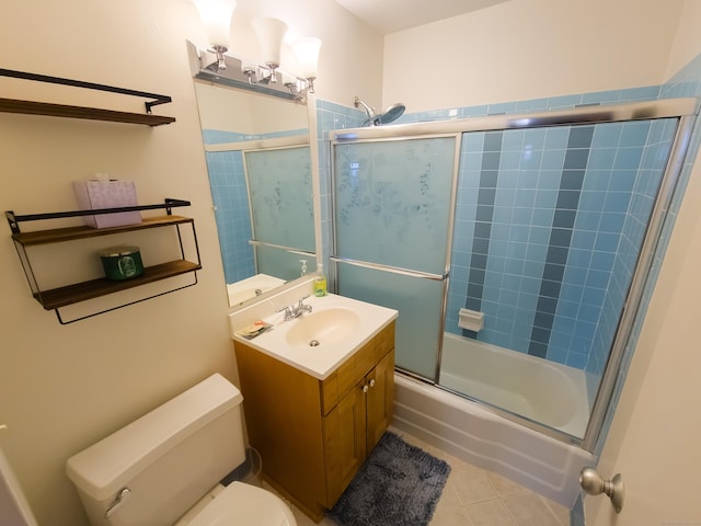 full bathroom with toilet, bath / shower combo with glass door, and vanity