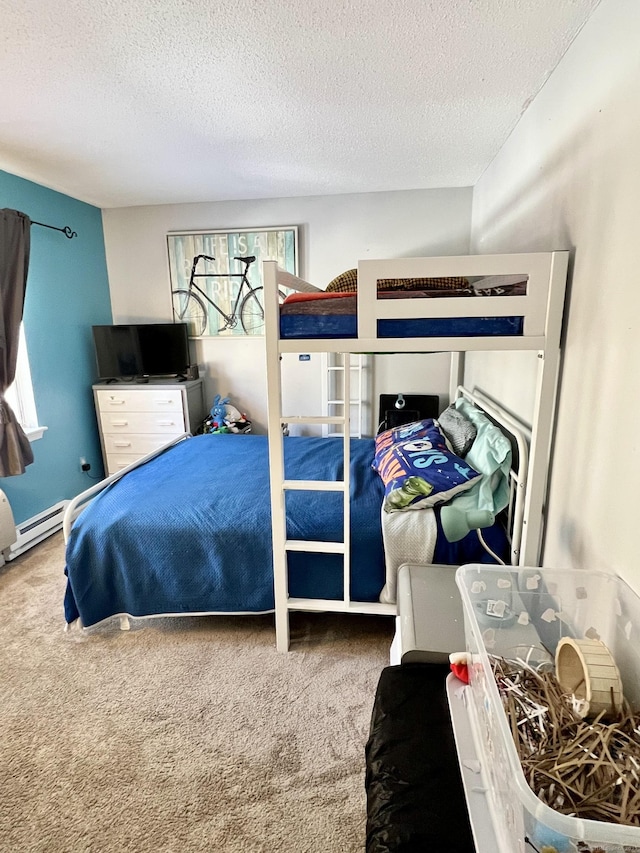 bedroom with a textured ceiling and carpet