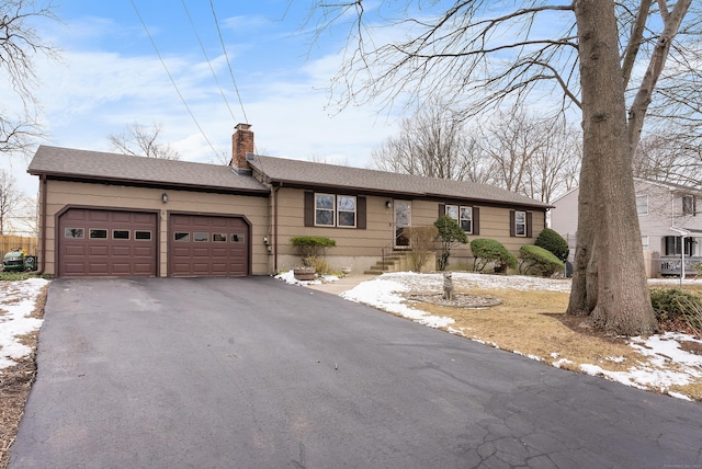 ranch-style home with a garage