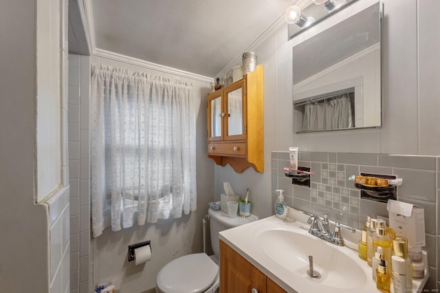 bathroom featuring toilet, decorative backsplash, crown molding, and vanity