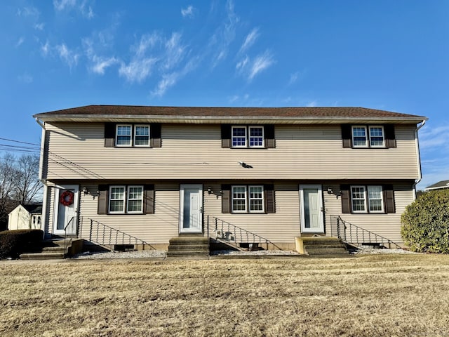 view of front of home with a front lawn